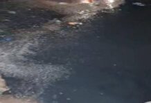 Inundada de aguas servidas calle Colombia del barrio Cruz Verde